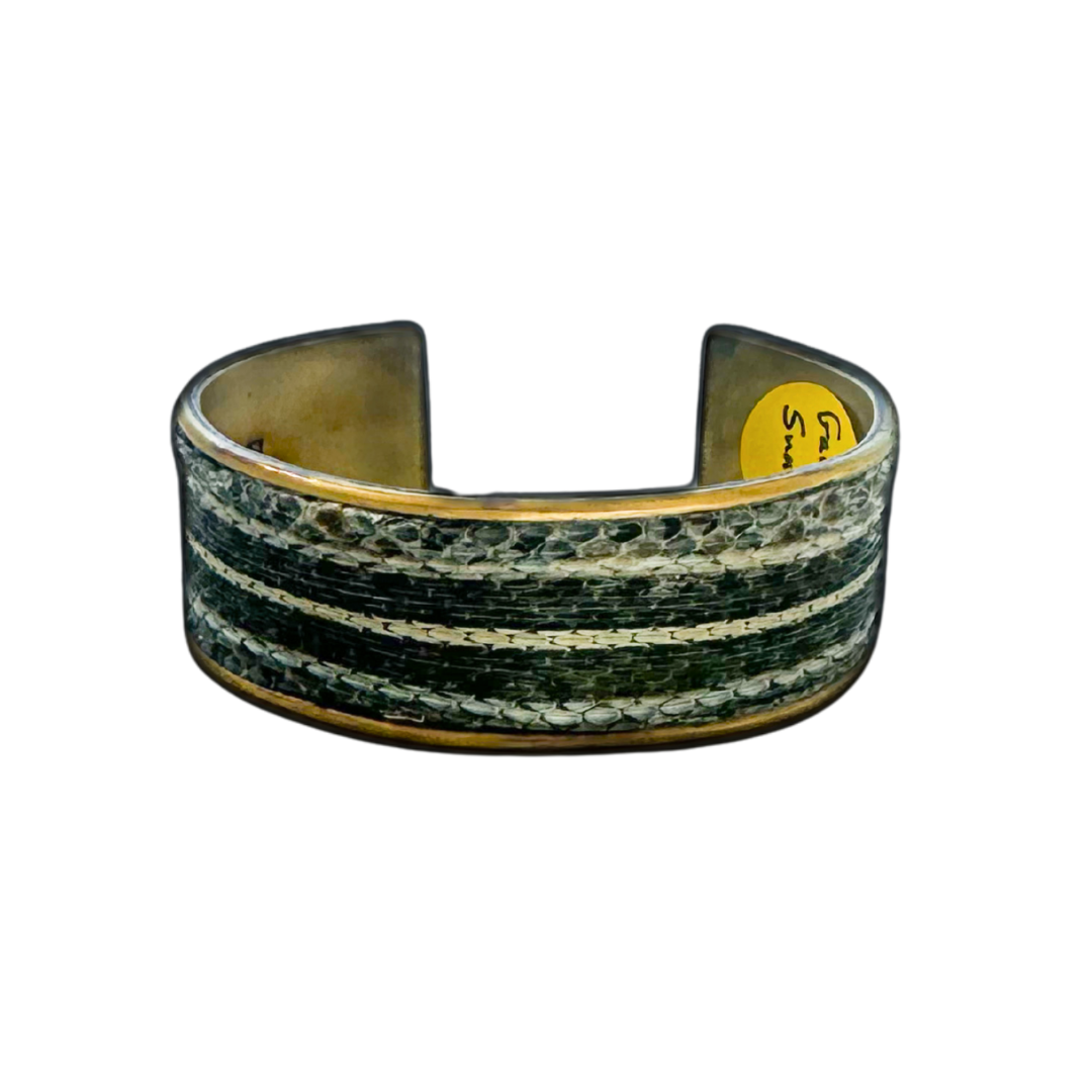 Men's 1-inch gold cuff bracelet handcrafted with genuine garter snake skin featuring green and ivory striping, natural texture, and polished brass interior; nature inspired men’s jewelry by Redd Dott.