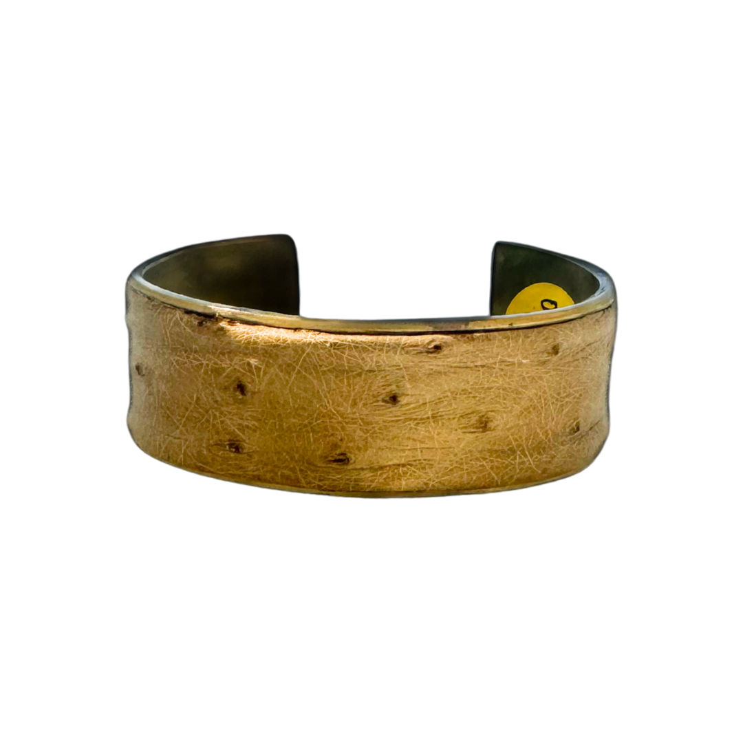 1-inch gold cuff bracelet handcrafted with genuine ostrich leather in natural tan tones, featuring subtle dotted texture and polished brass interior; men’s statement jewelry by Redd Dott.