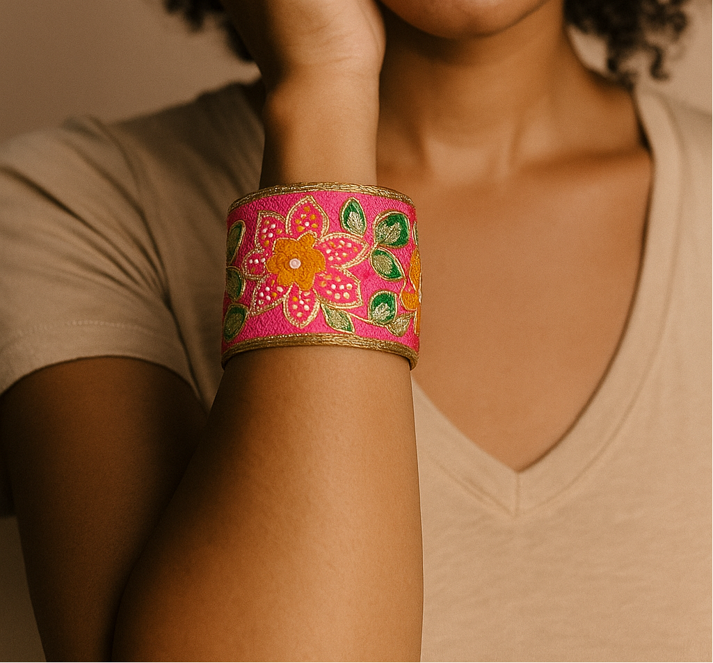 Woman wearing the Amen Custom Stamped Cuff Bracelet featuring bright pink embroidered fabric with gold florals and green leaves, handcrafted in Shreveport, LA by Redd Dott Jewelry.