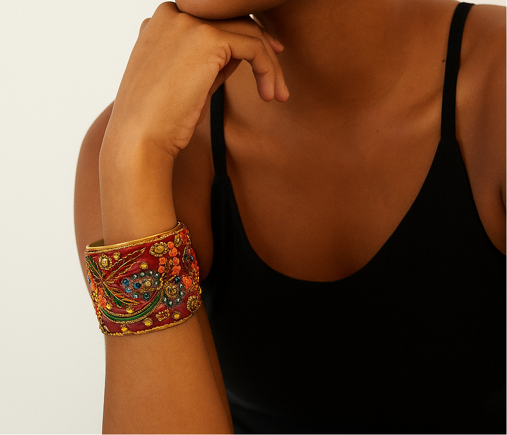 Woman wearing the Atlas Personalized Brass Cuff Bracelet with ruby-red embroidered fabric and multicolor floral beadwork — handcrafted in Shreveport, LA by Redd Dott Jewelry.