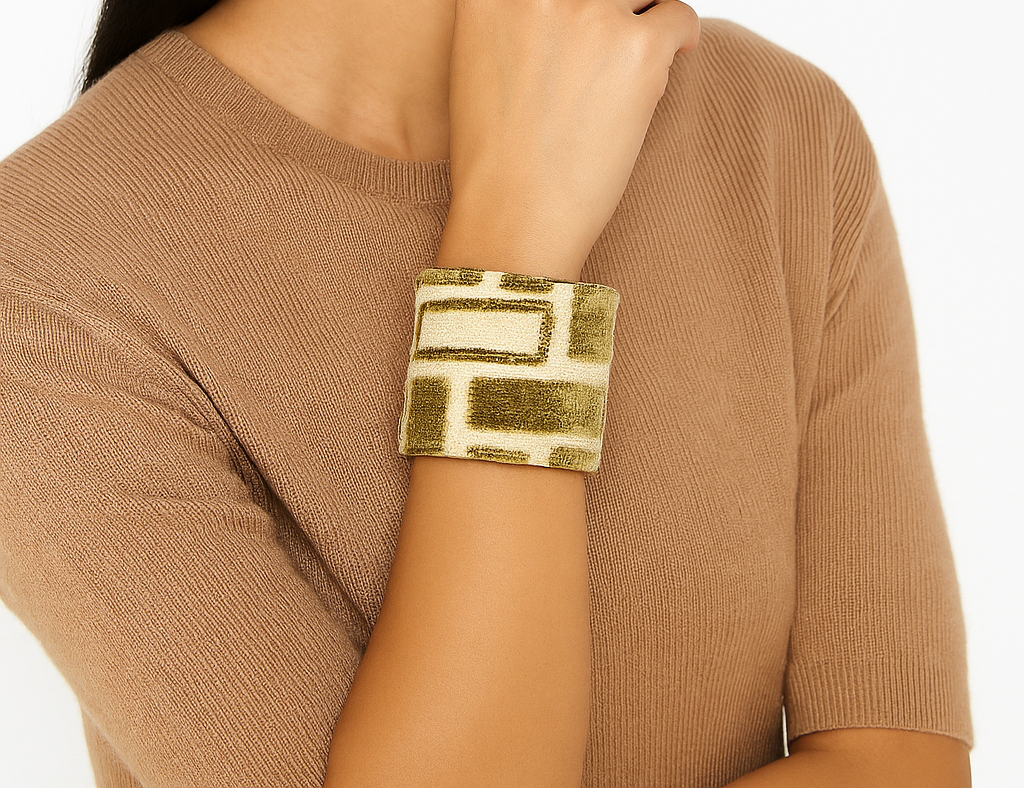 Woman wearing the Amiri Brass Cuff Bracelet with olive and cream velvet pattern, a handcrafted geometric cuff bracelet by Redd Dott Jewelry in Shreveport, LA.