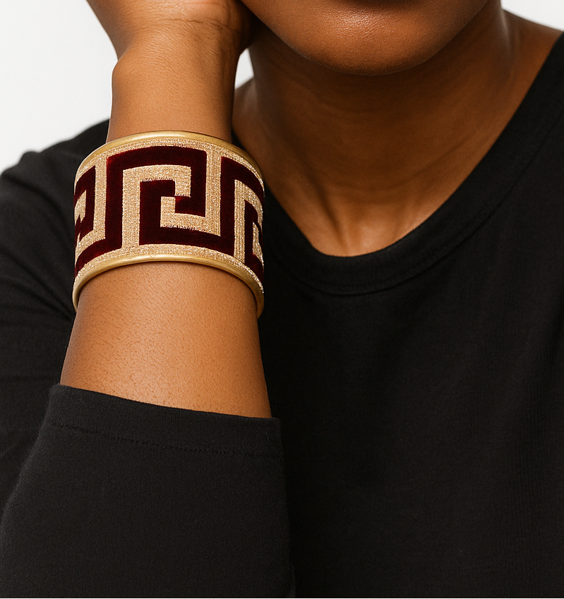 Woman wearing the Ambra Personalized Brass Cuff, a burgundy velvet cuff bracelet with ivory geometric design, handcrafted in Shreveport, LA by Redd Dott Jewelry.