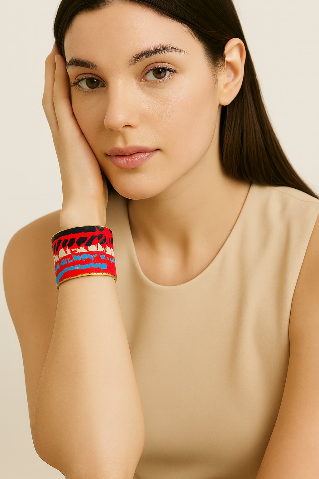 Redd Dott Maddyn 3-inch cuff bracelet with bold abstract embroidery in vivid red, black, white, and electric blue, framed in brass for a striking modern look.