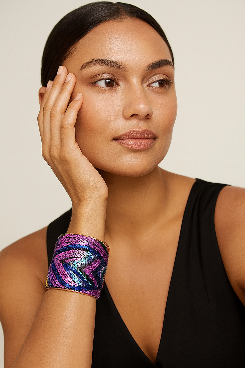Front view of the Redd Dott Mardi Life 3-inch cuff bracelet, embellished with bold pink, blue, and purple sequins in a striking chevron design framed in polished brass, capturing the vibrant spirit of Mardi Gras celebrations.