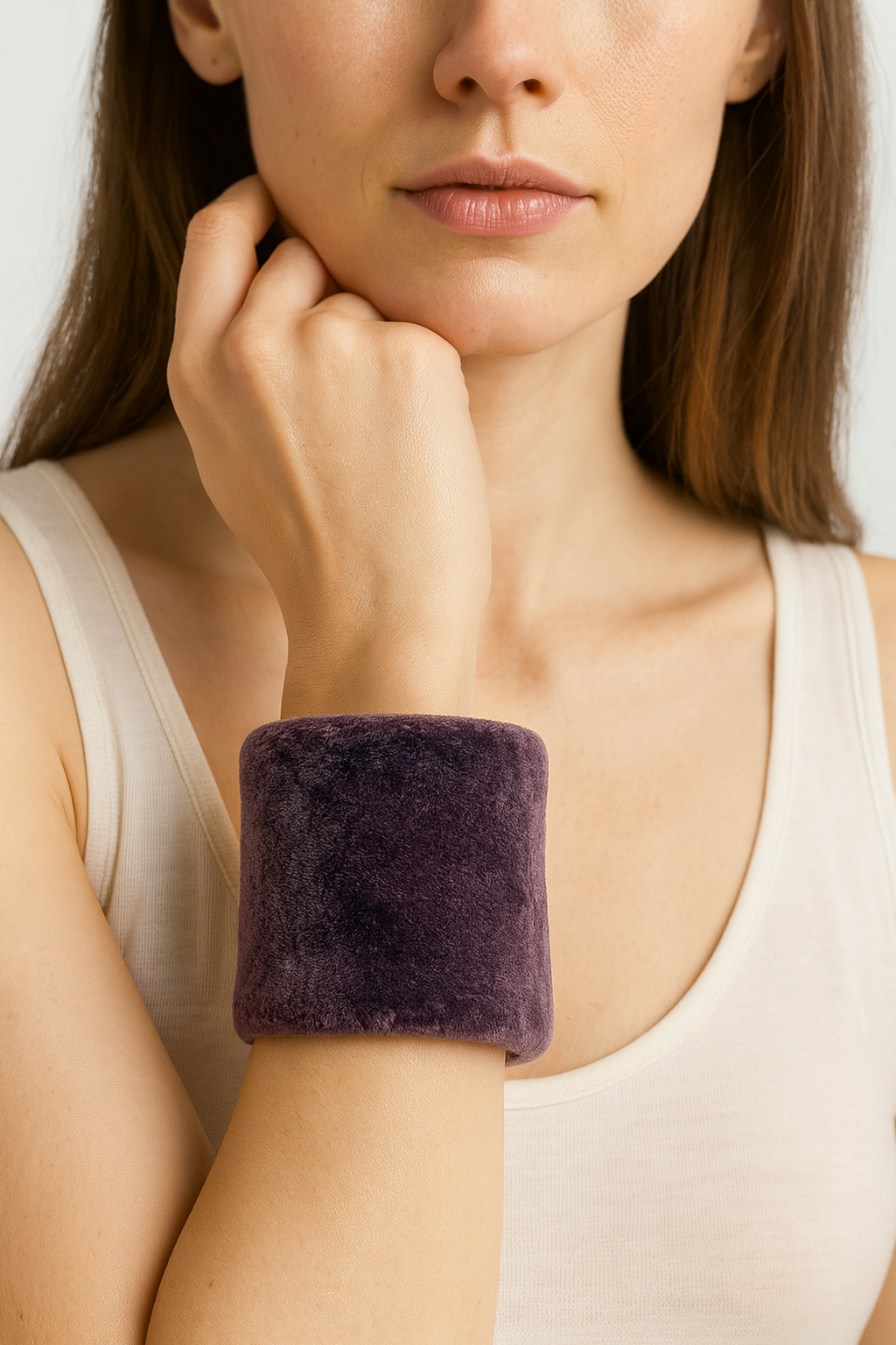Woman wearing the Redd Dott Pansy 3-inch cuff bracelet, a bold statement piece wrapped in plush deep violet velvet with a soft, luxurious texture and wide silhouette for modern elegance.