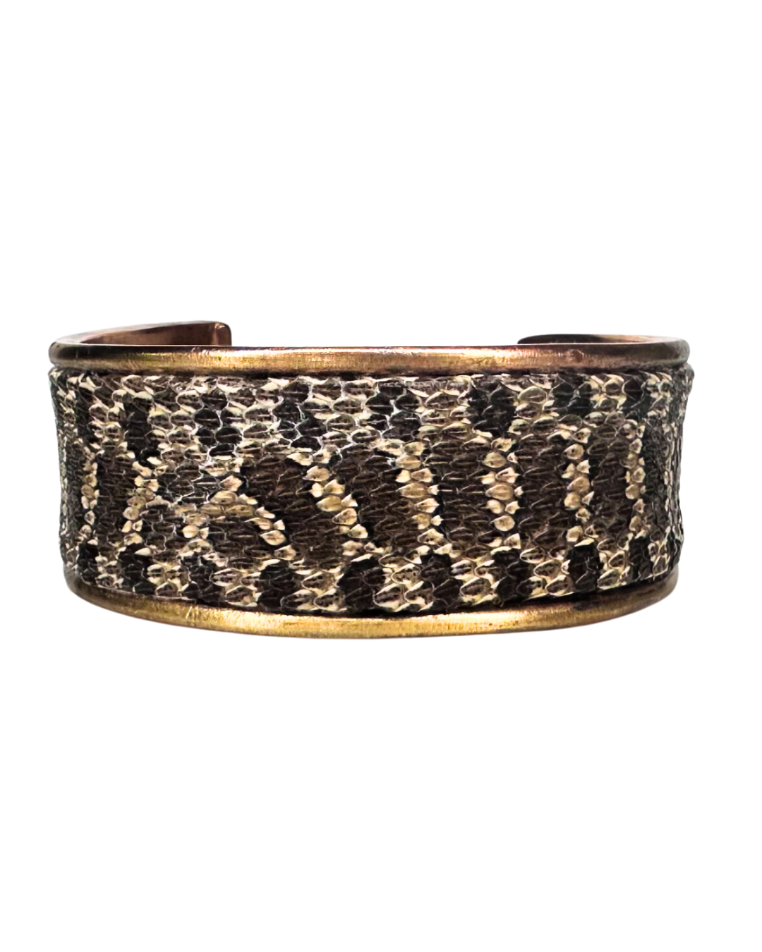 A handcrafted Redd Dott Jewelry cuff featuring genuine Hognose Snake skin, designed to showcase the unique textures and patterns of nature-inspired jewelry. A bold and organic statement piece for those who cherish the beauty of the wild.