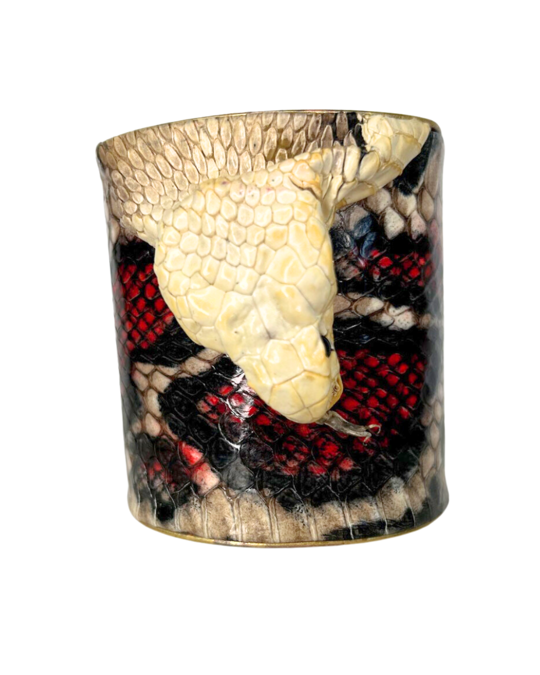 A striking Redd Dott Jewelry cuff featuring the preserved head of a genuine King Cobra snake skin. This unique piece of nature-inspired jewelry showcases the snake’s intricate scales and powerful design, making it a bold statement accessory.