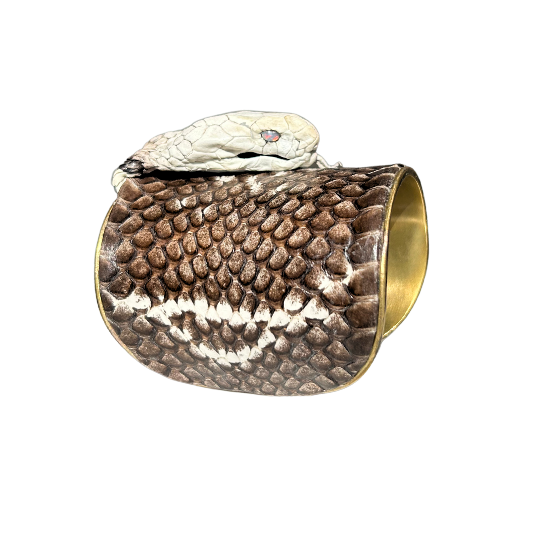 Side view of handcrafted brown king cobra gold cuff bracelet featuring ivory and espresso scales, opal gemstone eyes, and polished brass interior, handcrafted in Shreveport, LA by Redd Dott Jewelry.