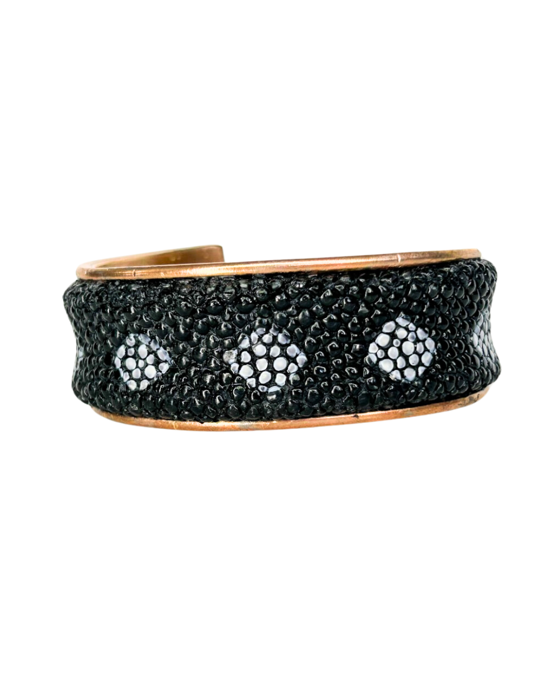 A Redd Dott Jewelry cuff made with genuine stingray skin, showcasing a nature-inspired design. The textured surface of the stingray skin provides a unique and luxurious look, refl